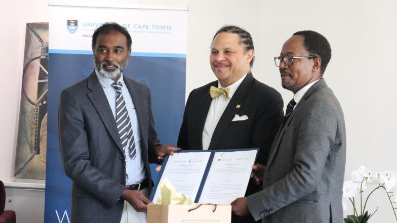 The three professors holding the newly signed MoU