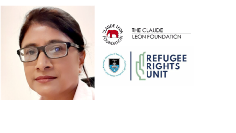 woman faces camera with specs, with two logos as part of the image