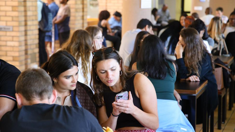 Student chat in the Kramer Cafe