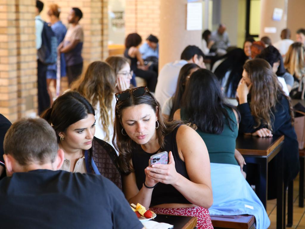 Student chat in the Kramer Cafe